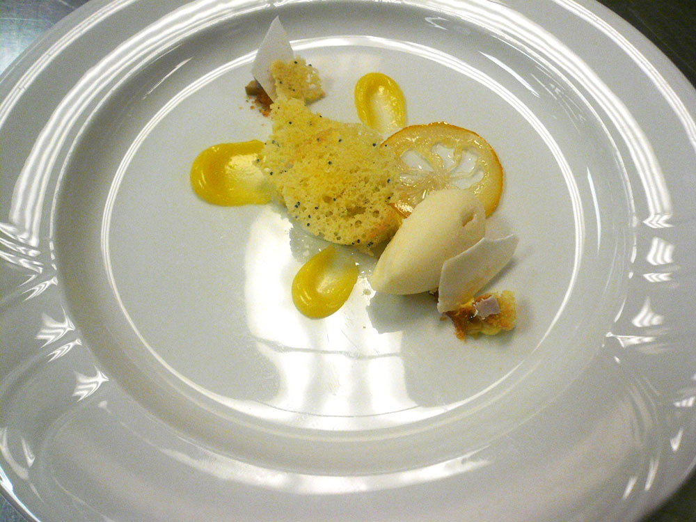 Olive oil emolution, lemon custard, meringue chip, lemon sorbet and candied olive